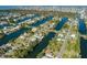 Aerial view of waterfront community with single Gathering homes and canals at 3276 Sea Grape Dr, Hernando Beach, FL 34607