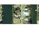 This is an aerial view of a waterfront property with a dock on a canal in a residential neighborhood at 3276 Sea Grape Dr, Hernando Beach, FL 34607