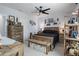 Spacious bedroom with rustic wooden furniture and a ceiling fan at 3276 Sea Grape Dr, Hernando Beach, FL 34607
