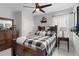Guest bedroom with a rustic wooden bed and checkered bedding at 3276 Sea Grape Dr, Hernando Beach, FL 34607
