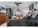 Bedroom with wooden bed, large stuffed dog, and ceiling fan at 3276 Sea Grape Dr, Hernando Beach, FL 34607