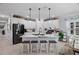 Spacious kitchen island with white cabinets and quartz countertops at 3276 Sea Grape Dr, Hernando Beach, FL 34607