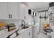 Bright laundry room with white cabinets and a marble countertop at 3276 Sea Grape Dr, Hernando Beach, FL 34607