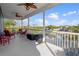 Spacious screened porch with lake views and ceiling fans at 3276 Sea Grape Dr, Hernando Beach, FL 34607