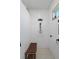Walk-in shower with hexagon tile floor and built-in seat at 3276 Sea Grape Dr, Hernando Beach, FL 34607