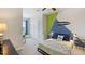 Charming bedroom with a fun wall design and twin bed at 5039 Captain Davis Dr, Wimauma, FL 33598
