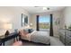 Charming bedroom with a stylish bed and window seat at 5050 Captain Davis Dr, Wimauma, FL 33598