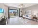 Relaxing living room with sliding glass doors leading to a patio at 5050 Captain Davis Dr, Wimauma, FL 33598