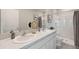 Modern bathroom with dual vanity, shower, and tasteful finishes at 5054 Captain Davis Dr, Wimauma, FL 33598