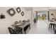 Modern dining area with metal table and woven chairs at 5054 Captain Davis Dr, Wimauma, FL 33598