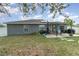 Large backyard with patio, grill, and solar panels at 5956 Nyberg Rd, North Port, FL 34291