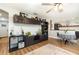 Bright living room with hardwood floors, comfy sofa, and built-in shelving at 5956 Nyberg Rd, North Port, FL 34291