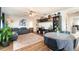 Living room with hardwood floors, neutral decor, and ample natural light at 5956 Nyberg Rd, North Port, FL 34291