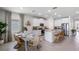Modern kitchen with white cabinets, granite countertops, and an island at 6758 Broad River Ave, Land O Lakes, FL 34638