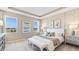 Bright main bedroom with large windows and a sitting area at 6758 Broad River Ave, Land O Lakes, FL 34638