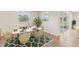 Elegant dining room with marble table and access to a patio at 6843 Daintree Ct, Land O Lakes, FL 34638