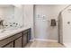 Double vanity bathroom with a walk-in shower at 7041 Broad River Ave, Land O Lakes, FL 34638