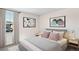 Bright bedroom with neutral bedding and decor at 7055 Broad River Ave, Land O Lakes, FL 34638
