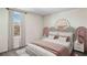 Bedroom with unique headboard and neutral bedding at 7055 Broad River Ave, Land O Lakes, FL 34638