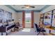 Bright office with window, built-in shelving, and comfortable seating at 7060 Broad River Ave, Land O Lakes, FL 34638