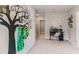 Upstairs hallway with a tree decal, desk, and plenty of storage at 7115 Broad River Ave, Land O Lakes, FL 34638