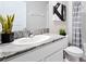 Small bathroom with single sink, granite countertop, and shower/tub combo at 7210 Beaverhead Ln, Land O Lakes, FL 34638