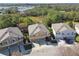 Aerial view of three-unit townhouses with two-car garages at 7626 Red Mill Cir, New Port Richey, FL 34653