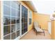 Private balcony with a lounge chair, overlooking trees at 9024 White Sage Loop # 37, Lakewood Ranch, FL 34202