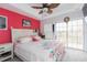 Bright bedroom with a queen bed and access to a private balcony at 9024 White Sage Loop # 37, Lakewood Ranch, FL 34202