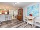 Bright dining area with a wooden hutch and eclectic decor at 9024 White Sage Loop # 37, Lakewood Ranch, FL 34202