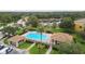 Community pool with surrounding patio and landscaping at 9024 White Sage Loop # 37, Lakewood Ranch, FL 34202