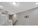 Spacious loft area with neutral walls and carpeting, ideal for a home office or media room at 11728 Cambium Crown Dr, Riverview, FL 33569