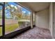 Screened patio with brick pavers and backyard view at 11728 Cambium Crown Dr, Riverview, FL 33569