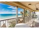 Spacious balcony with ocean view and seating for relaxation at 20040 Gulf Blvd # 605, Indian Shores, FL 33785