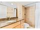 Bathroom with shower, granite countertop, and vanity at 20040 Gulf Blvd # 605, Indian Shores, FL 33785