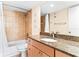 Bathroom with granite countertop, tiled shower and tub at 20040 Gulf Blvd # 605, Indian Shores, FL 33785