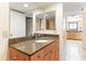Bathroom with granite countertop and kitchen view at 20040 Gulf Blvd # 605, Indian Shores, FL 33785