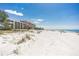 Beachfront view of Sand Castle III and other buildings at 20040 Gulf Blvd # 605, Indian Shores, FL 33785