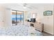 King bed, ocean view, balcony access, and dresser at 20040 Gulf Blvd # 605, Indian Shores, FL 33785