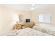Bedroom with two beds, desk and ceiling fan at 20040 Gulf Blvd # 605, Indian Shores, FL 33785