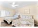 Two queen beds, nightstands and ceiling fan at 20040 Gulf Blvd # 605, Indian Shores, FL 33785