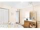 Bedroom with dresser, desk, and closet at 20040 Gulf Blvd # 605, Indian Shores, FL 33785