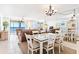 Bright dining area with glass-top table and ocean view at 20040 Gulf Blvd # 605, Indian Shores, FL 33785