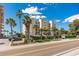 Building exterior with ocean view and palm trees at 20040 Gulf Blvd # 605, Indian Shores, FL 33785