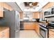 Modern kitchen featuring stainless steel appliances and granite countertops at 20040 Gulf Blvd # 605, Indian Shores, FL 33785