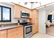Updated kitchen with stainless steel appliances and light wood cabinets at 20040 Gulf Blvd # 605, Indian Shores, FL 33785