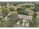 Aerial view of a villa community showcasing homes, landscaping, and a golf course at 2620 Newcomb Ct, Sun City Center, FL 33573