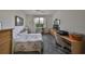 Serene bedroom featuring a floral bedspread and a window at 2620 Newcomb Ct, Sun City Center, FL 33573