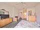 Comfortable bedroom with large dresser and en-suite bathroom at 2620 Newcomb Ct, Sun City Center, FL 33573