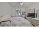 Bedroom with a floral comforter, dresser, and large closet at 2620 Newcomb Ct, Sun City Center, FL 33573